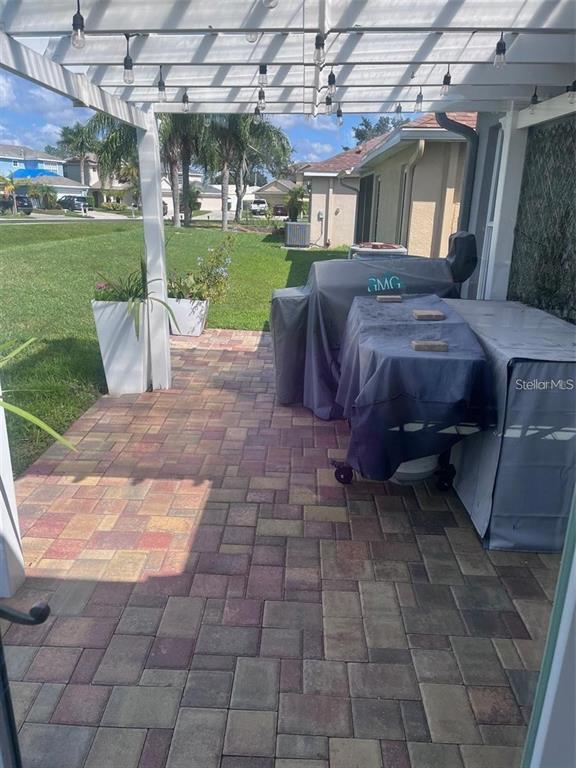 5519 Turtle Crossing Loop Tampa, FL 33625 - Photo 22 of 23 a view of a house with backyard porch and sitting area