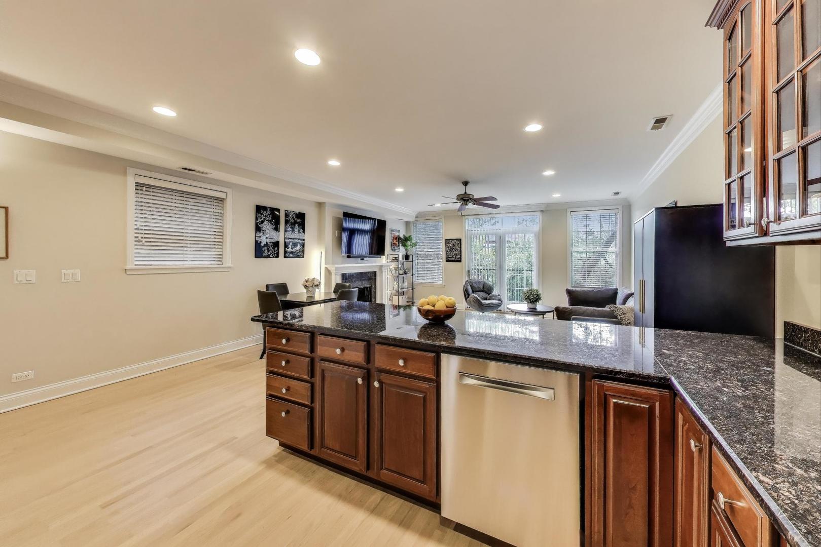 3507 North Reta Avenue, Unit 3 Chicago, IL 60657 - Photo 12 of 24 a kitchen with stainless steel appliances granite countertop a sink stove and refrigerator