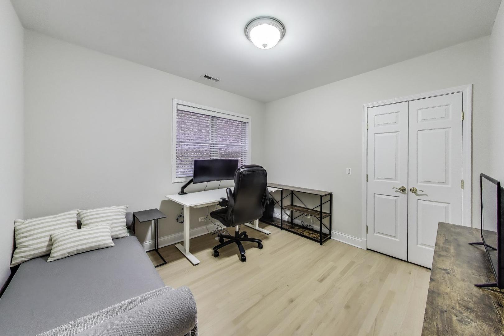 3507 North Reta Avenue, Unit 3 Chicago, IL 60657 - Photo 19 of 24 a view of a livingroom with workspace and a couch