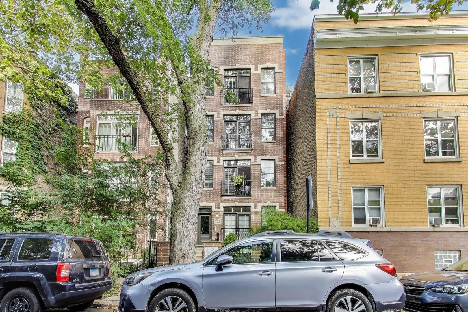 3507 North Reta Avenue, Unit 3 Chicago, IL 60657 - Photo 2 of 24 a front view of a residential apartment building with a yard