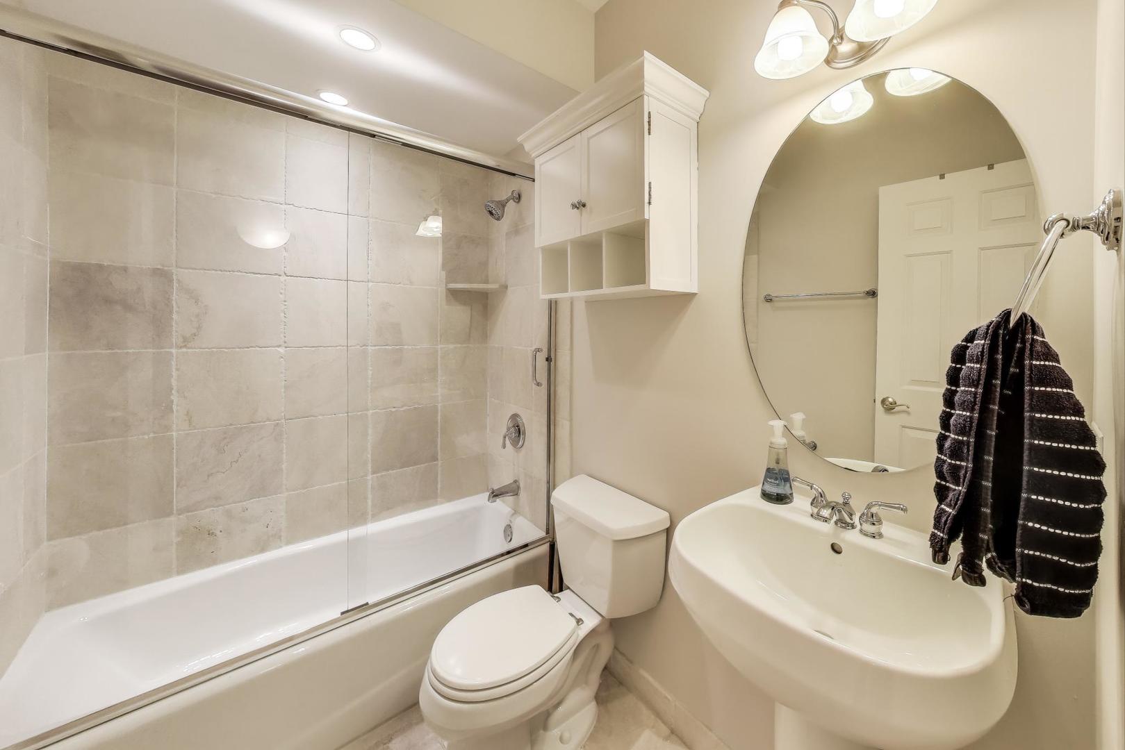 3507 North Reta Avenue, Unit 3 Chicago, IL 60657 - Photo 21 of 24 a bathroom with a sink toilet and shower