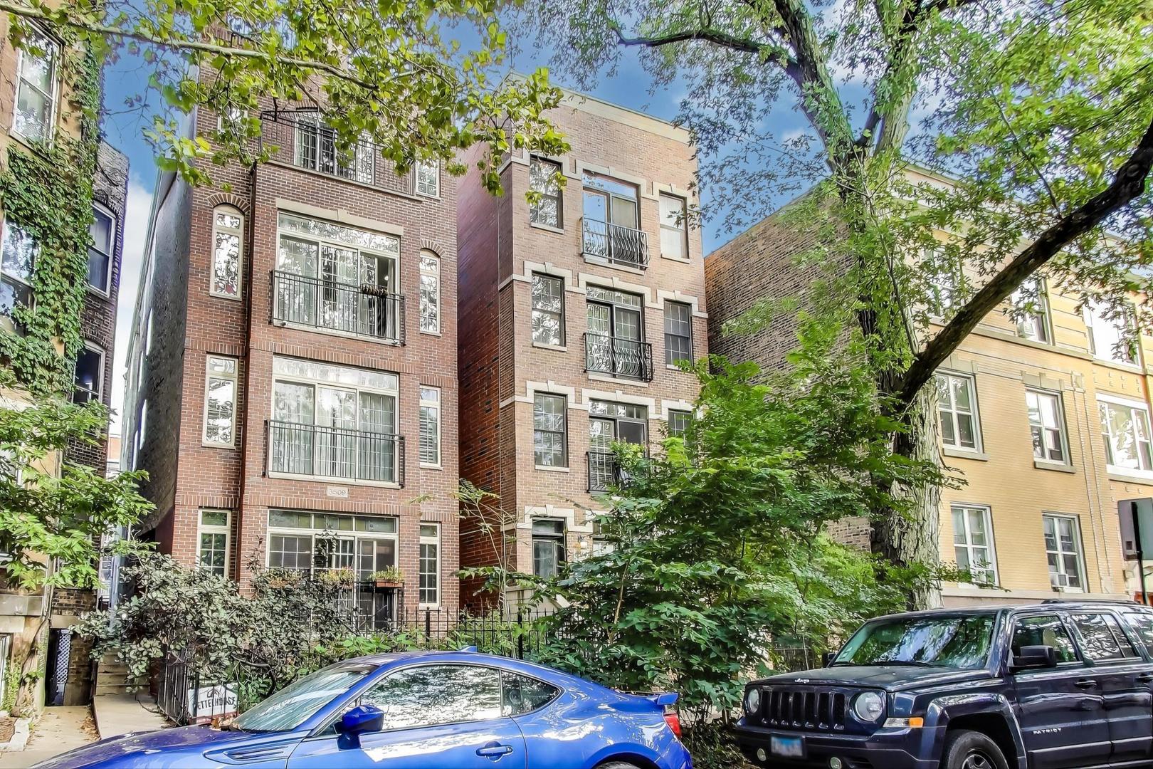 3507 North Reta Avenue, Unit 3 Chicago, IL 60657 - Photo 3 of 24 a car parked in front of a brick building