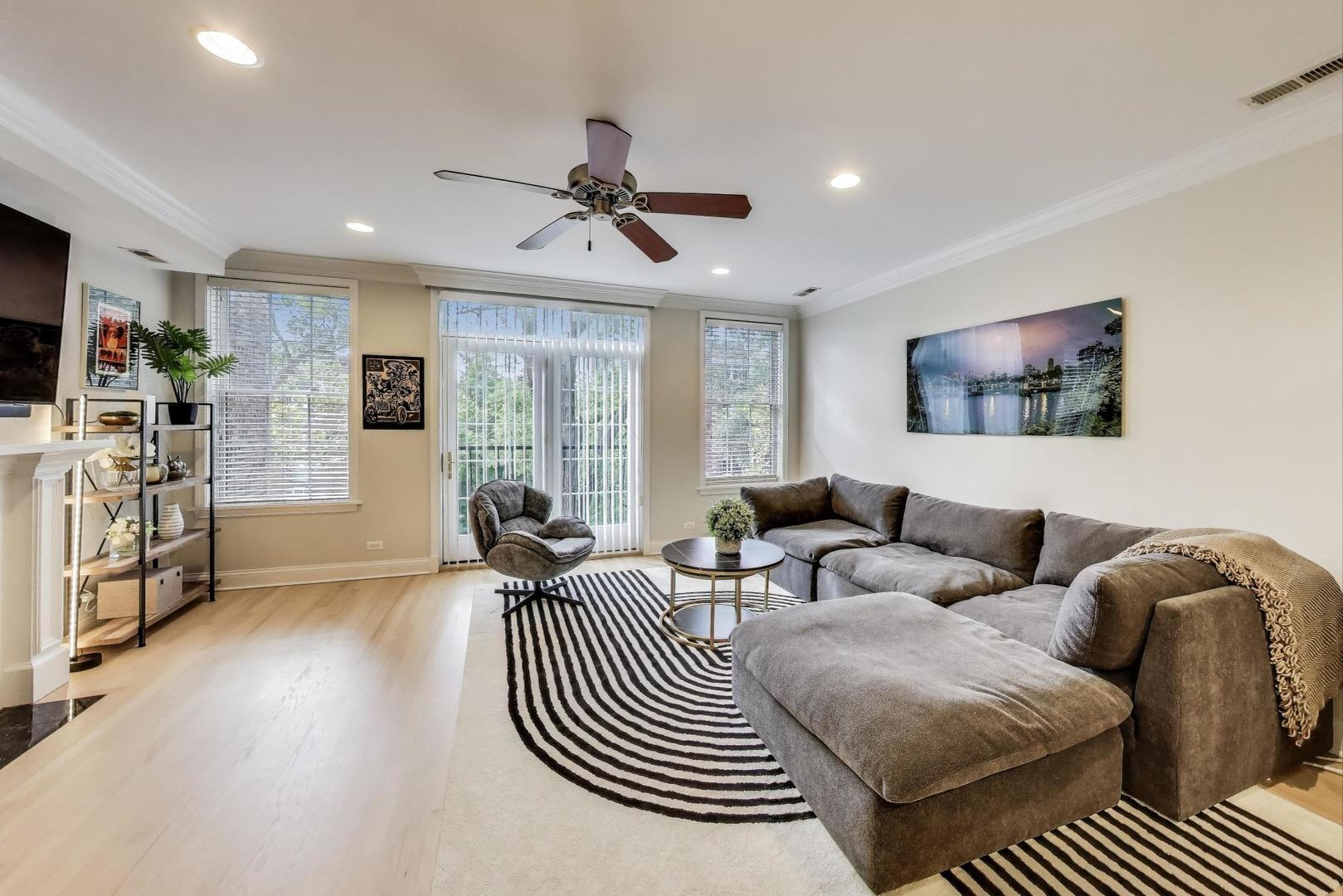 3507 North Reta Avenue, Unit 3 Chicago, IL 60657 - Photo 5 of 24 a living room with furniture and a flat screen tv