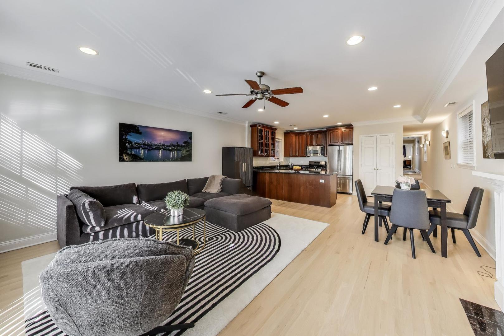 3507 North Reta Avenue, Unit 3 Chicago, IL 60657 - Photo 8 of 24 a living room with furniture kitchen view and a dining table