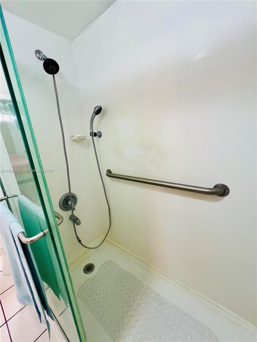 1331 Lincoln Road, Unit 701 Miami Beach, FL 33139 - Photo 11 of 18 a bathroom with a shower