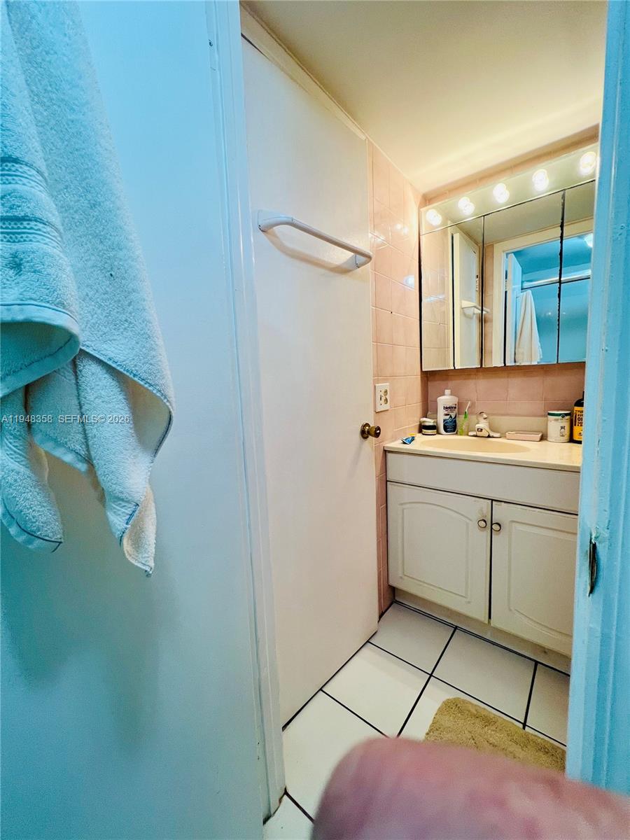 1331 Lincoln Road, Unit 701 Miami Beach, FL 33139 - Photo 13 of 18 a room with a walk in closet and mirror