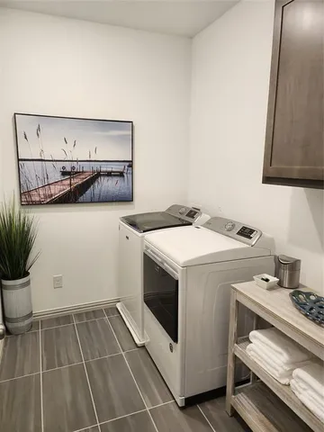 a room with furniture wall paintings and a window