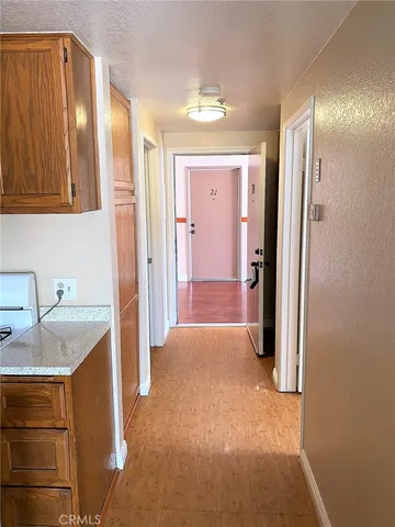 a view of a kitchen with a sink and cabinets