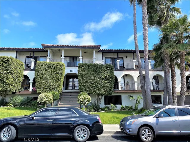 a front view of a house with parking space