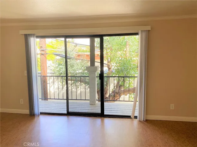 a view of room with balcony and ocean view
