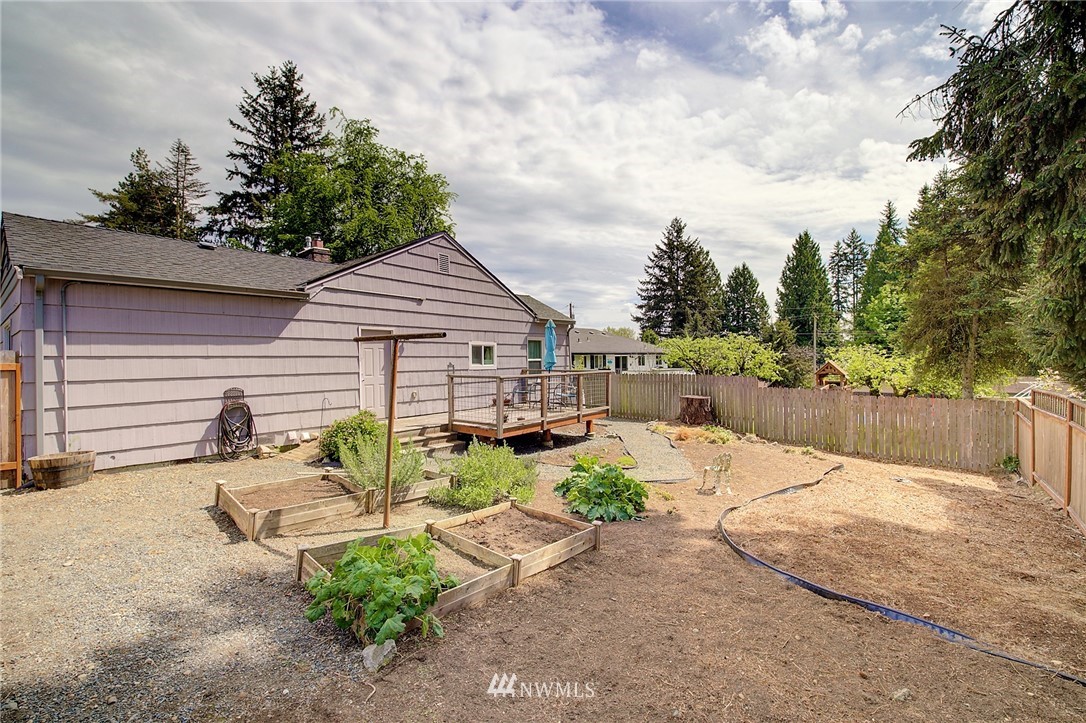 24316 Meridian Avenue South Bothell, WA 98021 - Photo 25 of 29 a view of house with backyard and sitting area