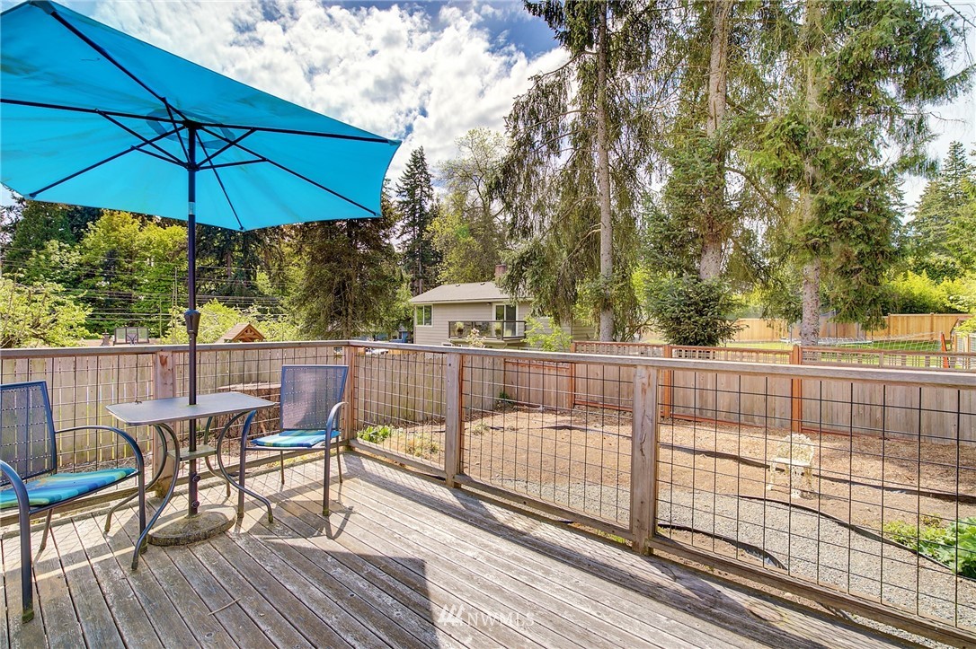 24316 Meridian Avenue South Bothell, WA 98021 - Photo 26 of 29 a view of balcony with wooden floor and outdoor seating