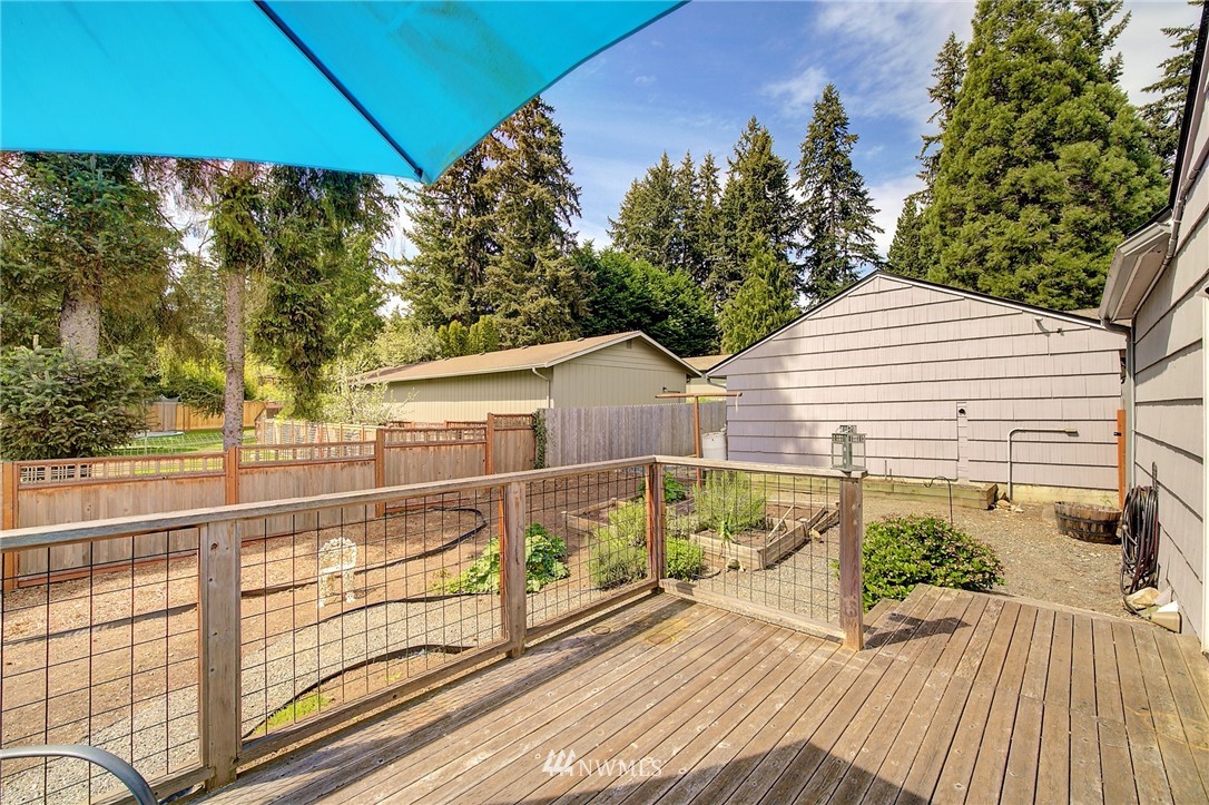 24316 Meridian Avenue South Bothell, WA 98021 - Photo 27 of 29 a view of a balcony with wooden floor and fence