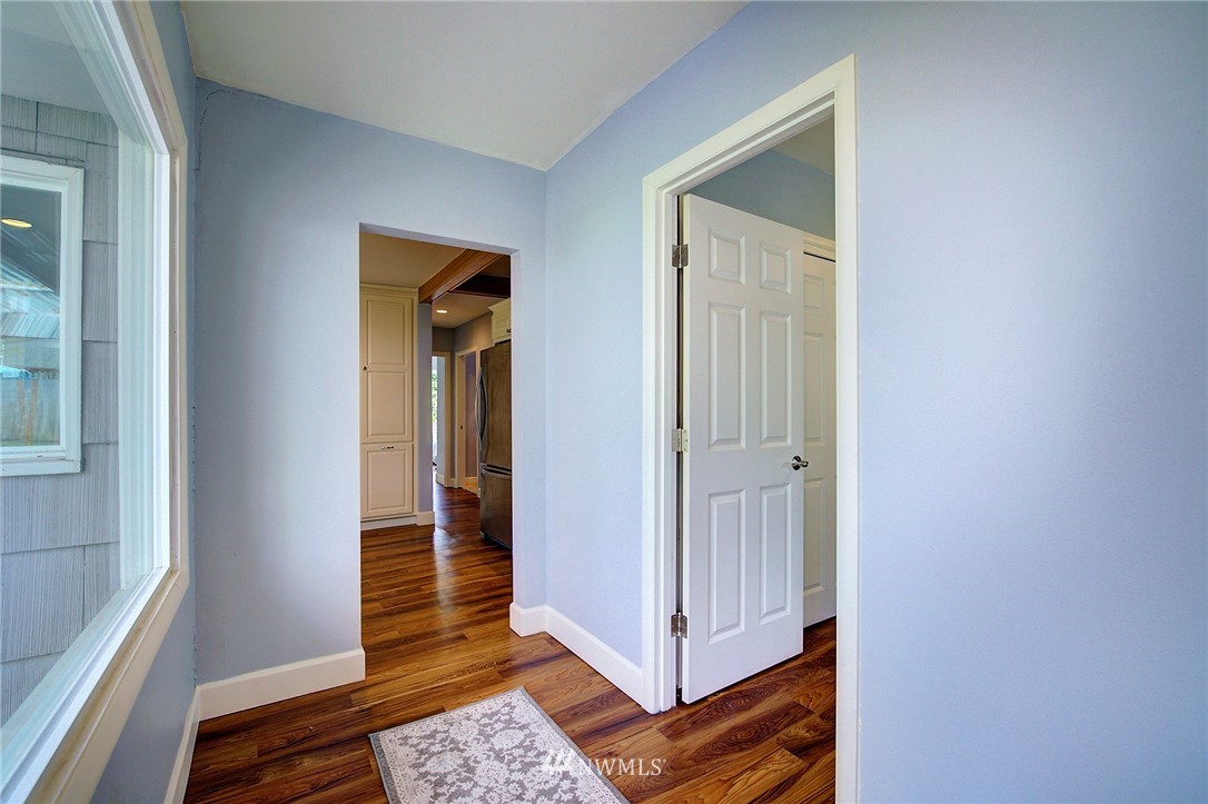 24316 Meridian Avenue South Bothell, WA 98021 - Photo 4 of 29 a view of a hallway with wooden floor and closet