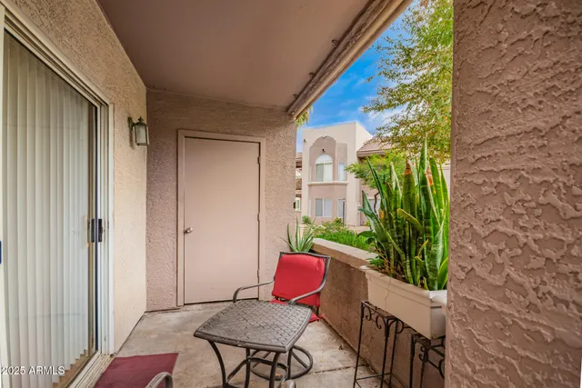 a view of a balcony dining area