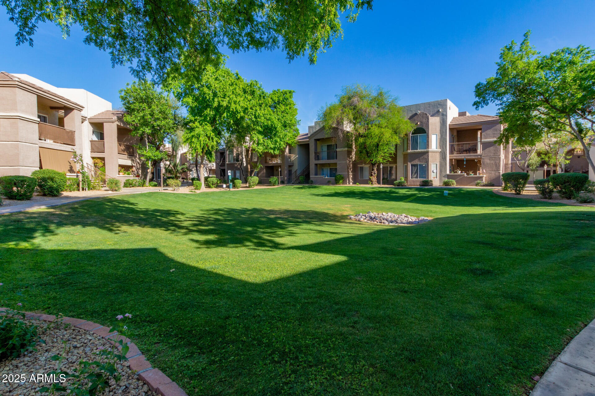 17017 North 12th Street, Unit 1123 Phoenix, AZ 85022 - Photo 27 of 48 a front view of a building with a garden