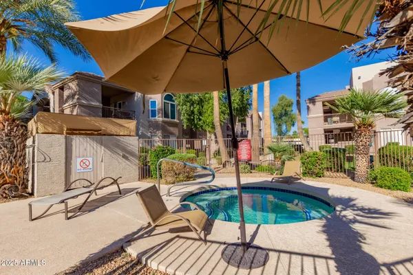 a view of a backyard with sitting area