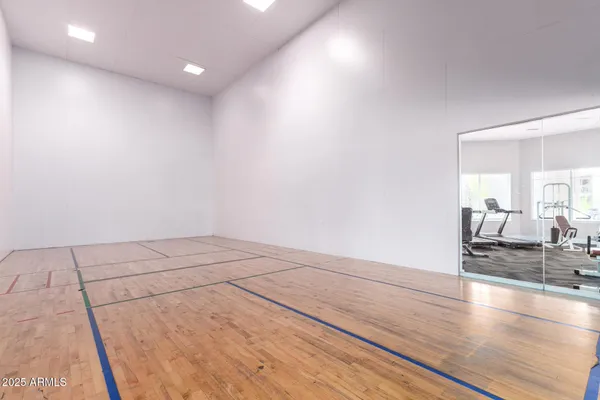 an empty room with wooden floor