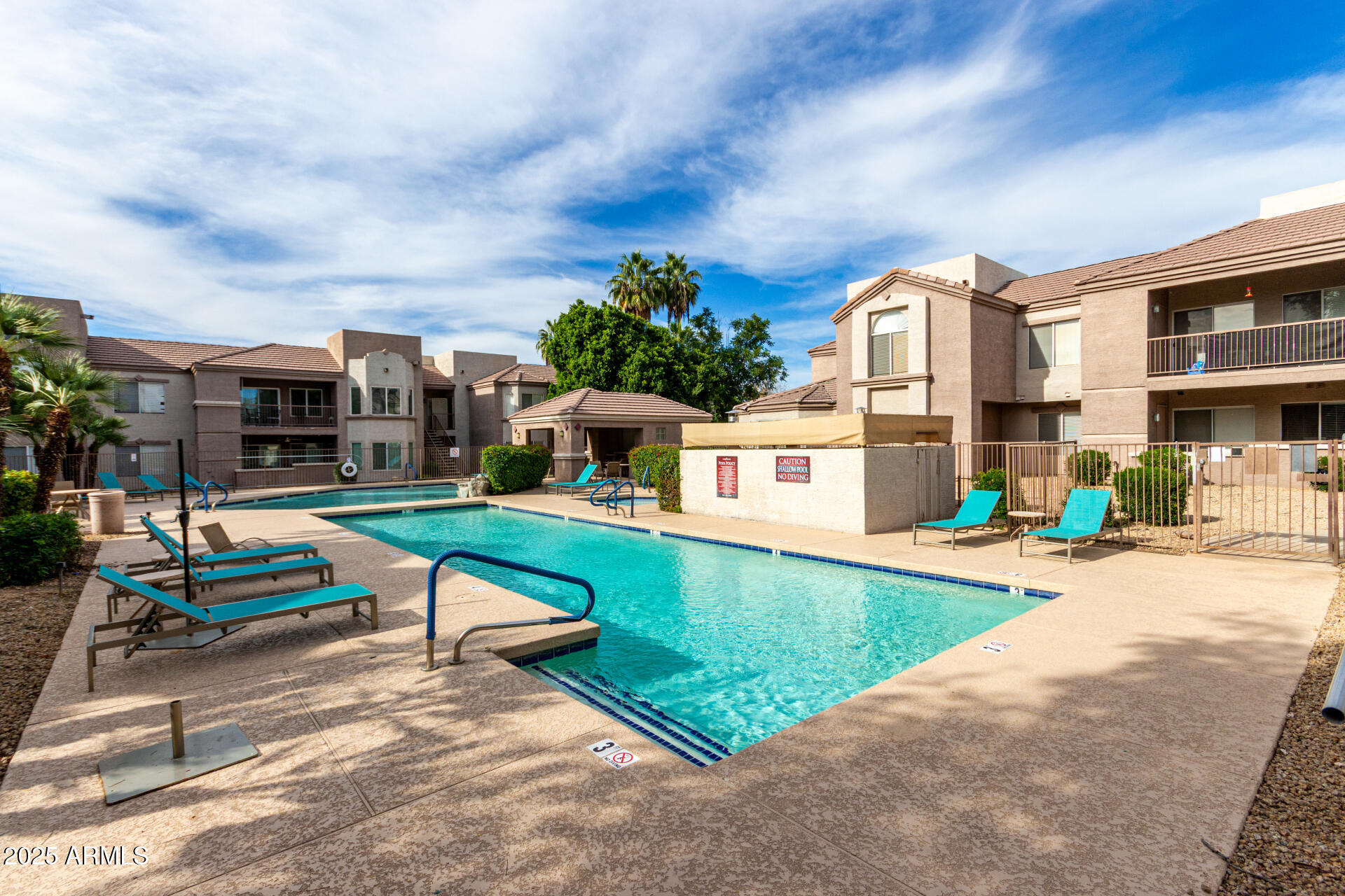 17017 North 12th Street, Unit 1123 Phoenix, AZ 85022 - Photo 46 of 48 a view of a swimming pool with a lounge chairs