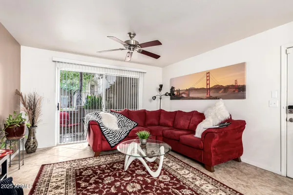 a living room with furniture and a large window