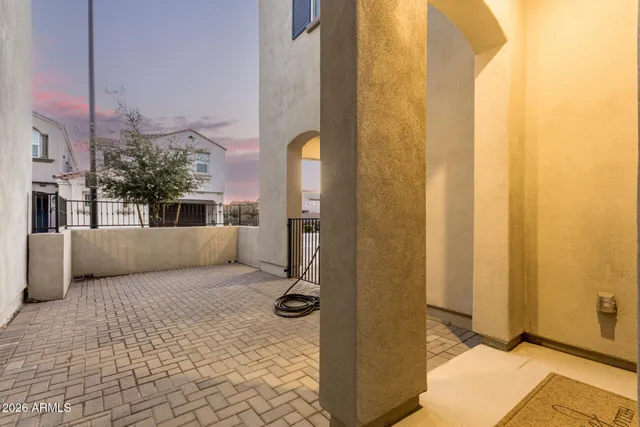 a view of an empty room with glass door