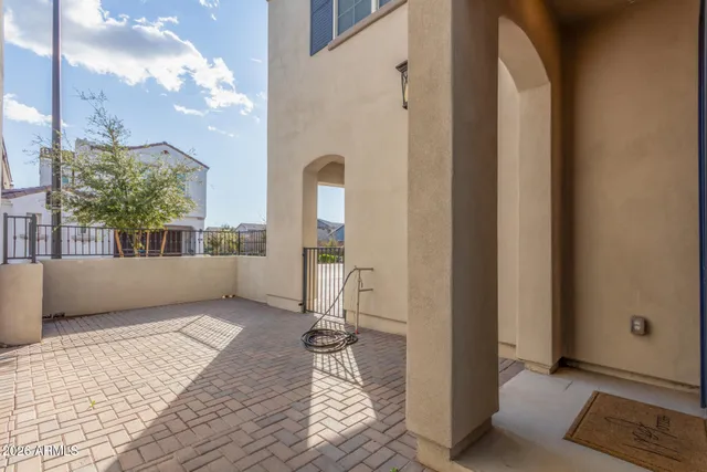 a view of a kitchen with a sink and a refrigerator