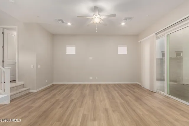 a view of kitchen with kitchen island stainless steel appliances cabinets a sink and a counter top space