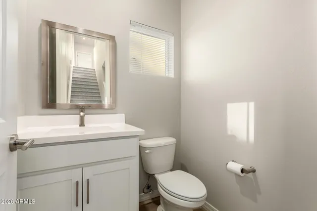 a spacious bathroom with a double vanity sink a mirror and a shower