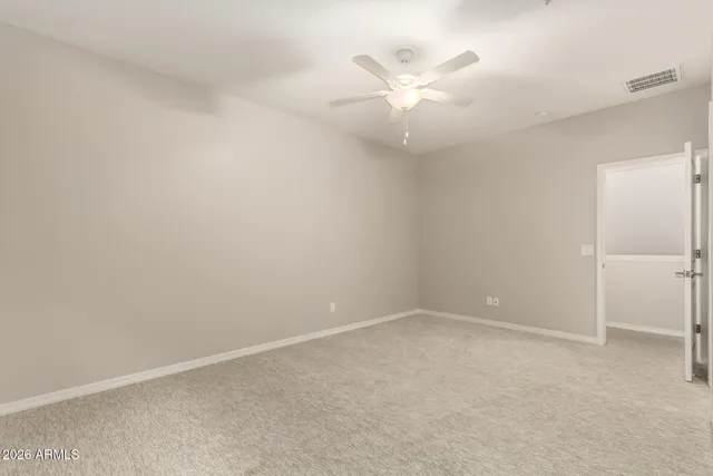 a view of a livingroom with wooden floor and staircase
