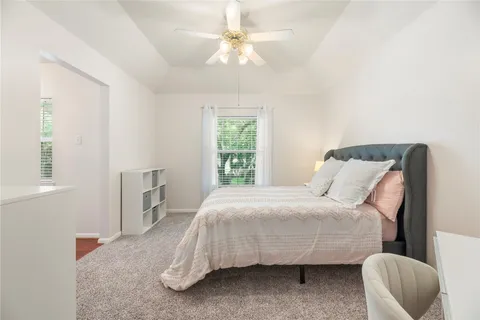a bedroom with a bed and a chair