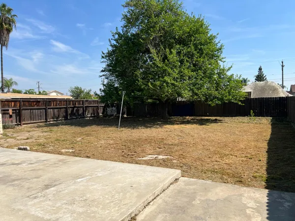a view of swimming pool with a yard