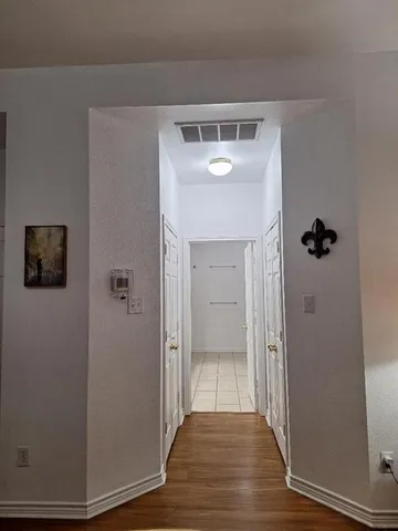a view of a kitchen from the hallway