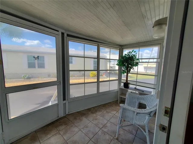 a kitchen with a sink cabinets and wooden floor