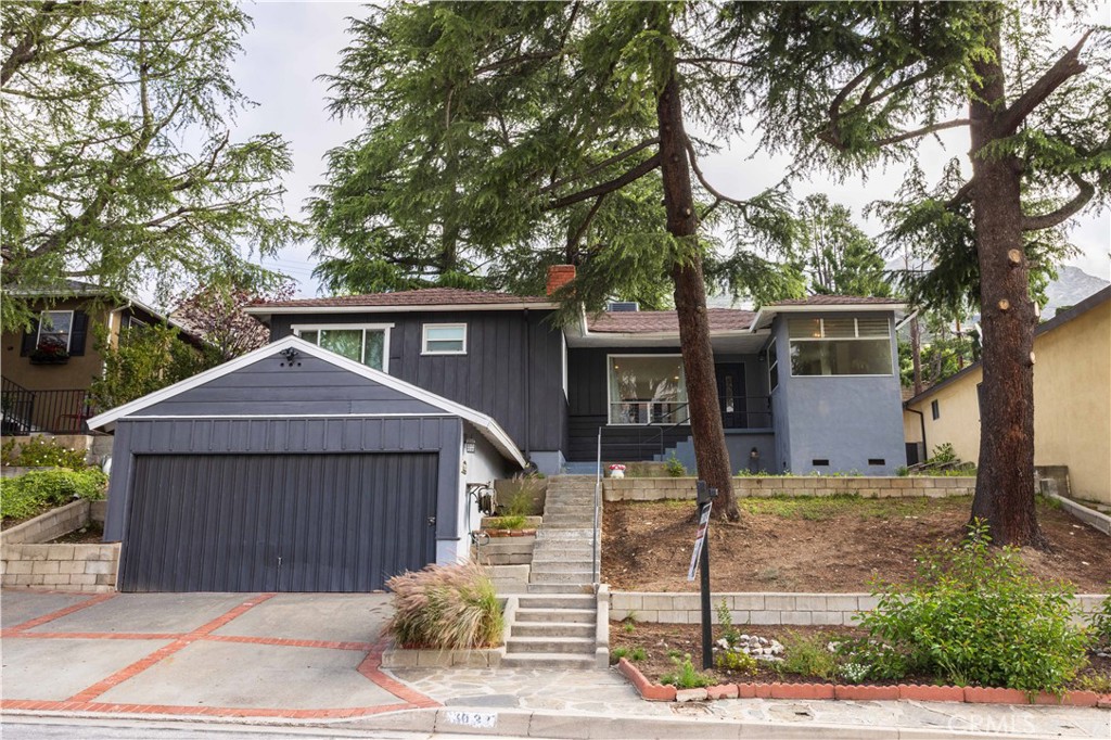 3035 Highridge Road La Crescenta, CA 91214 - Photo 1 of 1 a front view of a house with garden