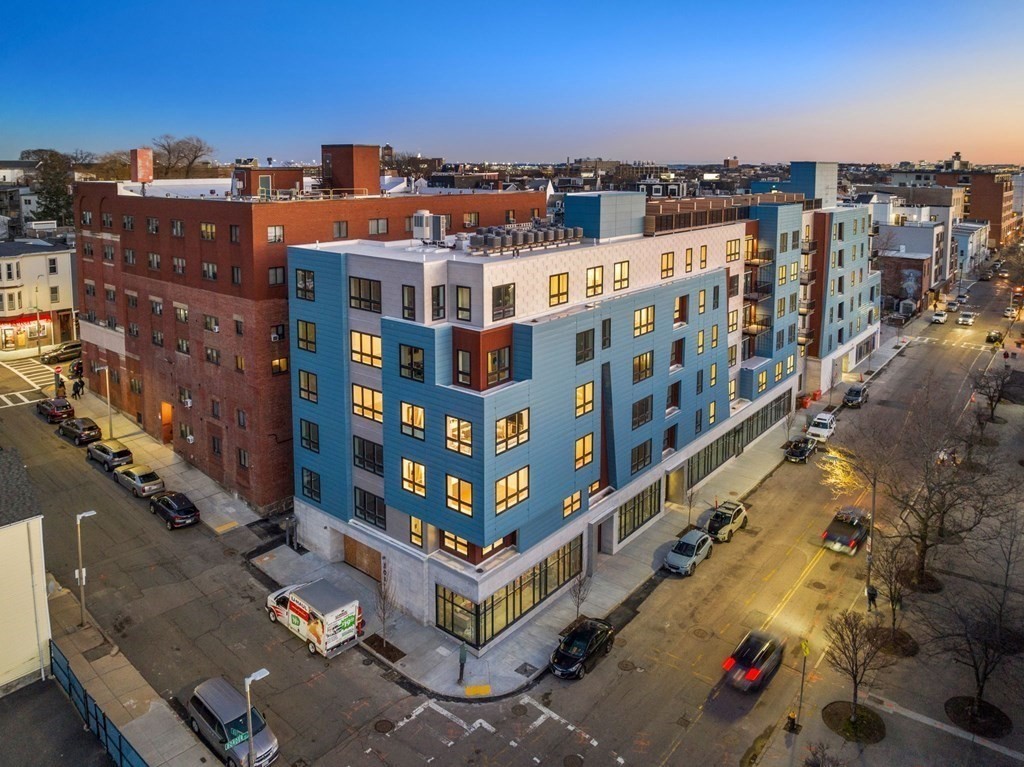 301 Border Street, Unit 406 Boston, MA 02128 - Photo 34 of 38 a large building with a city view