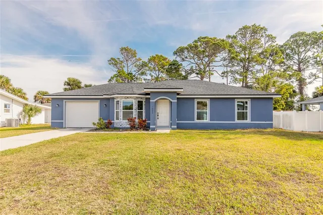 a view of a house with swimming pool and a yard