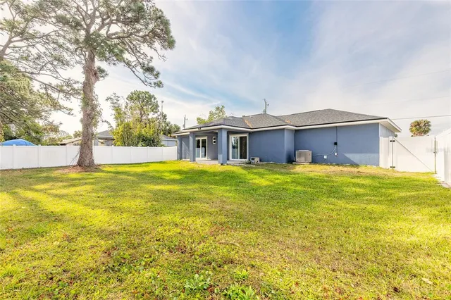 a house view with swimming pool in front of it