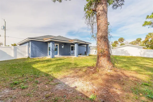 a house with swimming pool in front of it