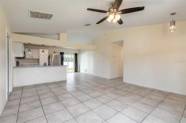 a view of a kitchen with a sink and cabinets