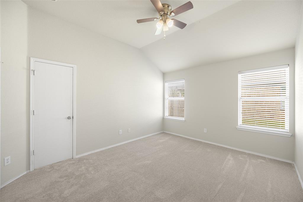 324 Meadow Ridge Drive Anna, TX 75409 - Photo 17 of 32 Large primary bedroom with fresh paint and carpet