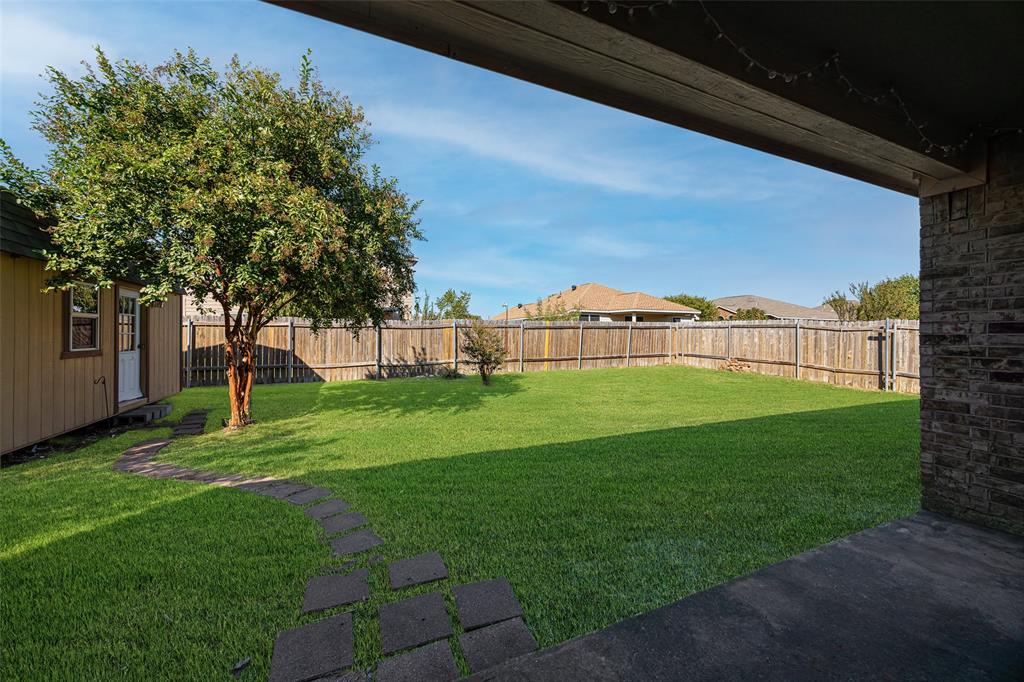 324 Meadow Ridge Drive Anna, TX 75409 - Photo 28 of 32 Covered back patio overlooks this spacious backyard