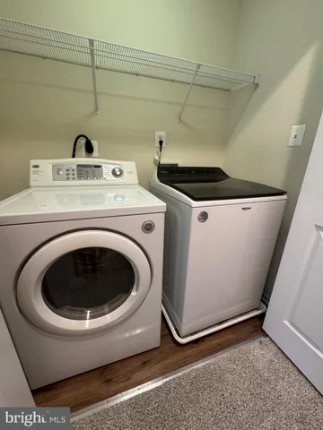 an empty room with wall & windows