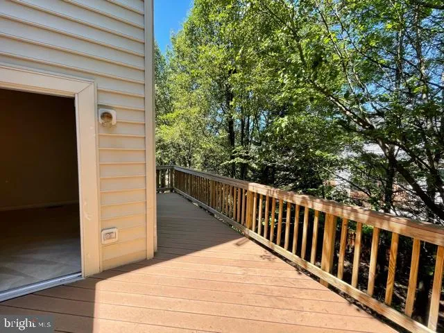 a view of balcony with wooden floor