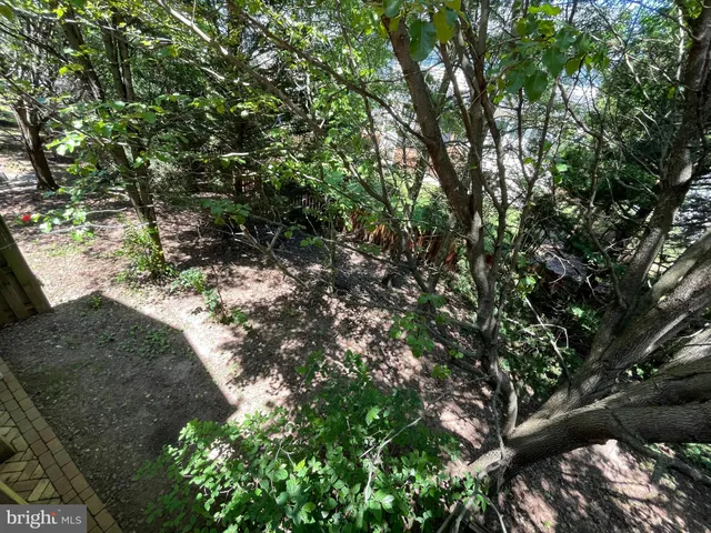 a view of a porch with a table and chairs
