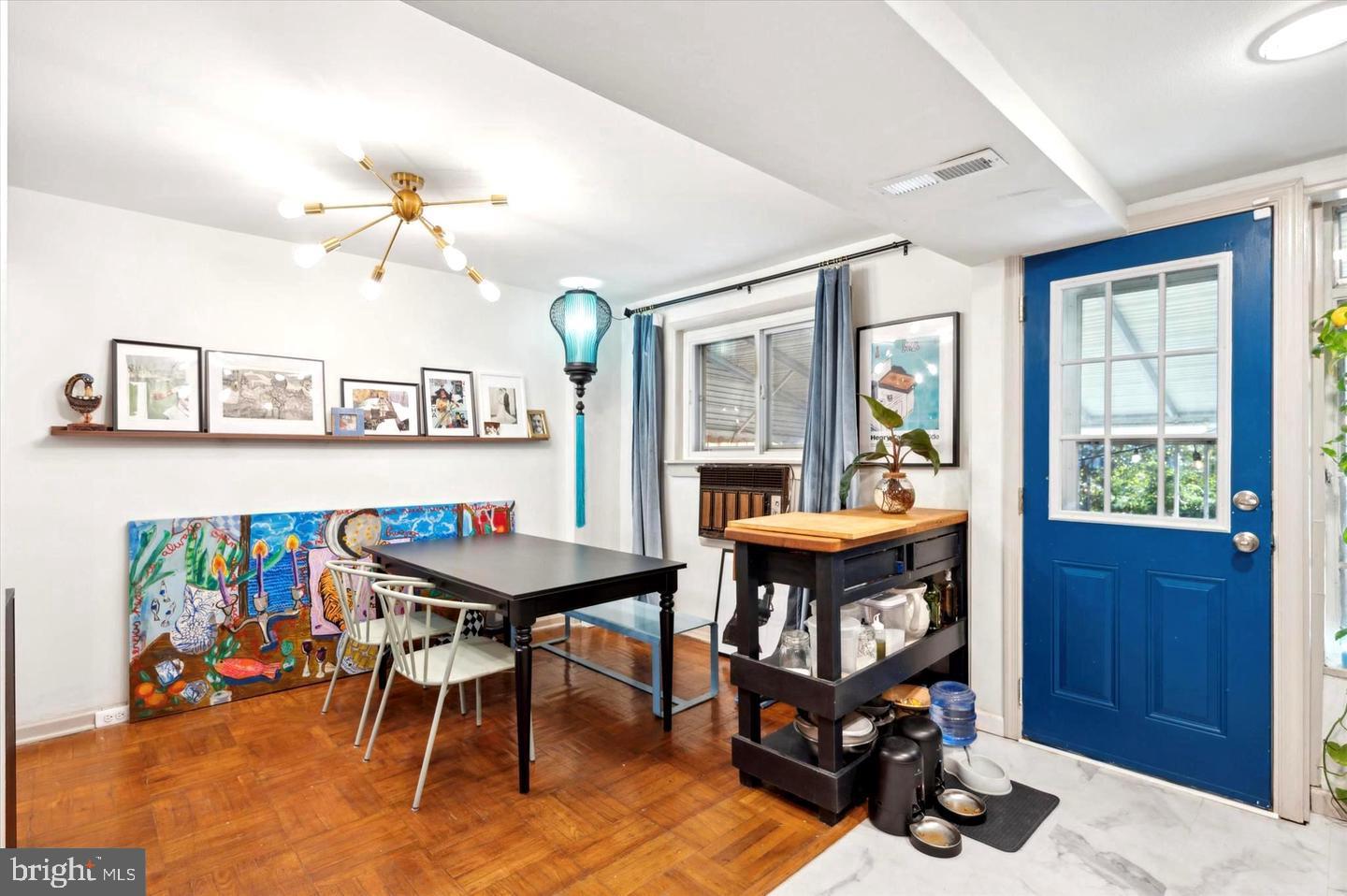 4572 Manayunk Avenue Philadelphia, PA 19128 - Photo 11 of 22 a view of a dining room with furniture window and wooden floor