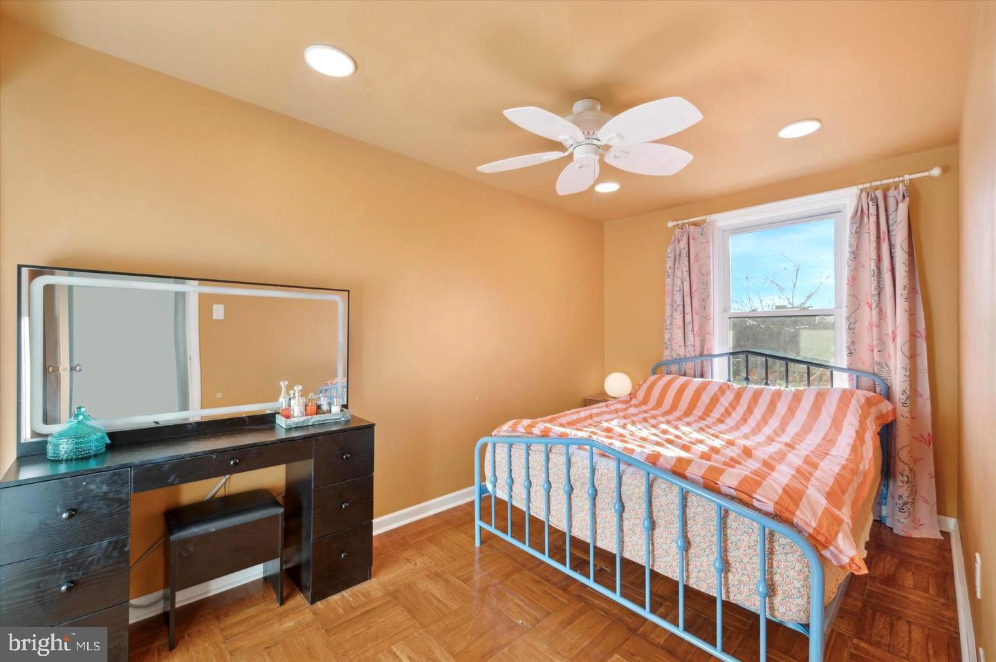 4572 Manayunk Avenue Philadelphia, PA 19128 - Photo 13 of 22 a bedroom with a bed and a chandelier