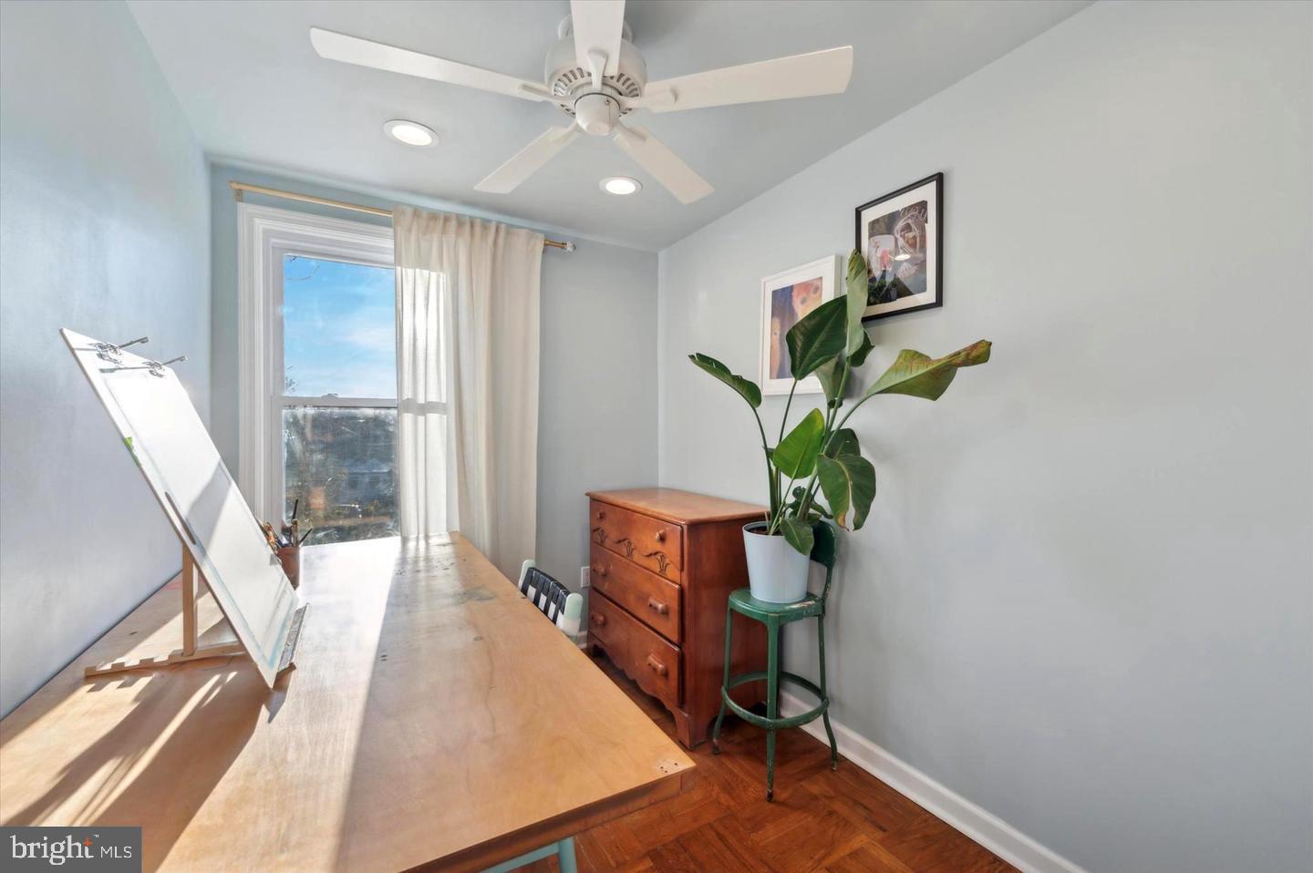 4572 Manayunk Avenue Philadelphia, PA 19128 - Photo 16 of 22 a living room with furniture and a potted plant