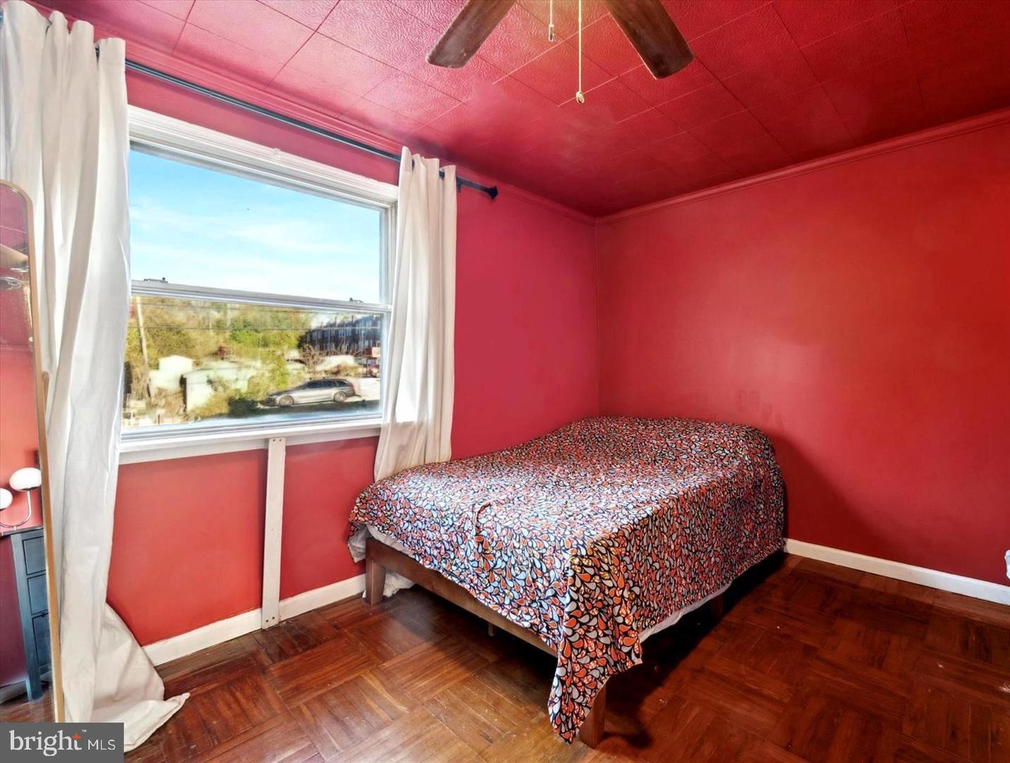 4572 Manayunk Avenue Philadelphia, PA 19128 - Photo 18 of 22 a bed sitting in a room next to a window