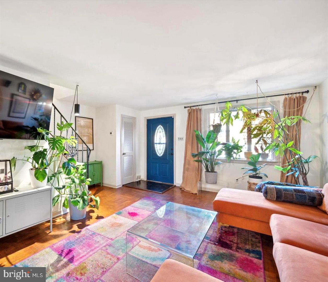 4572 Manayunk Avenue Philadelphia, PA 19128 - Photo 4 of 22 a living room with furniture and a potted plant