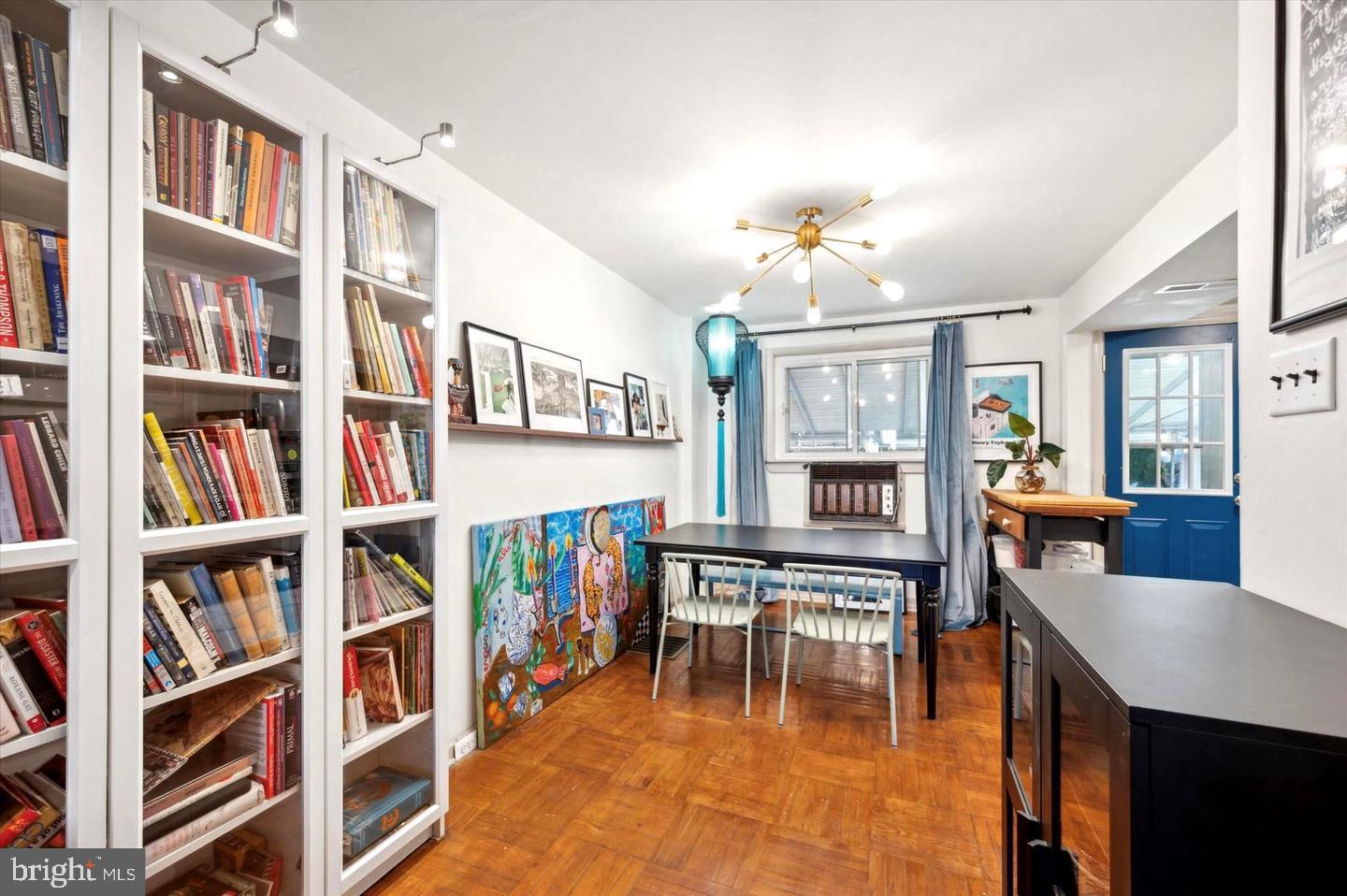 4572 Manayunk Avenue Philadelphia, PA 19128 - Photo 8 of 22 a living room with furniture and a book shelf